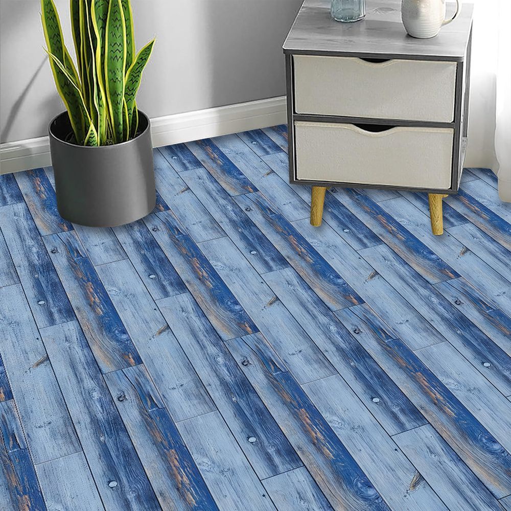 blue wood grain peel and stick floor tiles with plant and nightstand