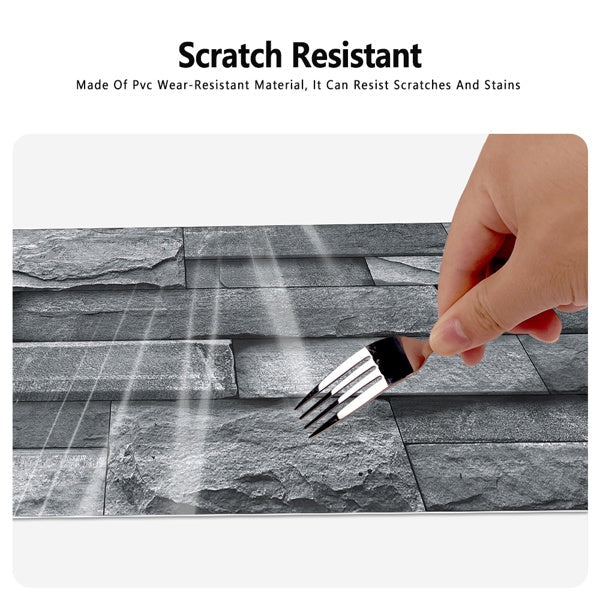 Imitation stone tile waterproof peel and stick light grey wallpaper being scratched with fork showing scratch resistance