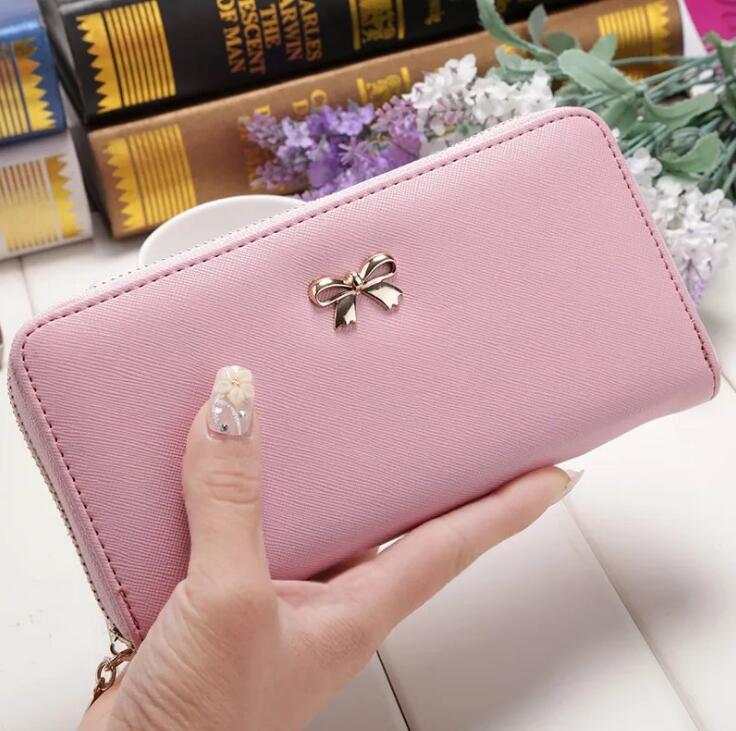 Pink PU ladies wallet handbag with zipper and bow detail, 19x9.5x3cm compact size