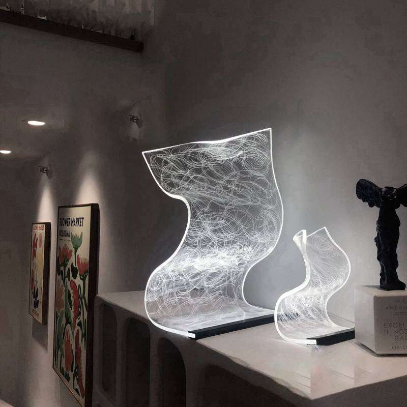 Warm high appearance level bedside lamp with artistic translucent wavy design and ambient white light for home decor