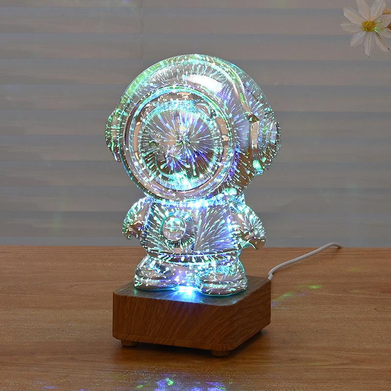 Spaceman 3D Fireworks USB night lamp with colorful light and planet design on wooden base