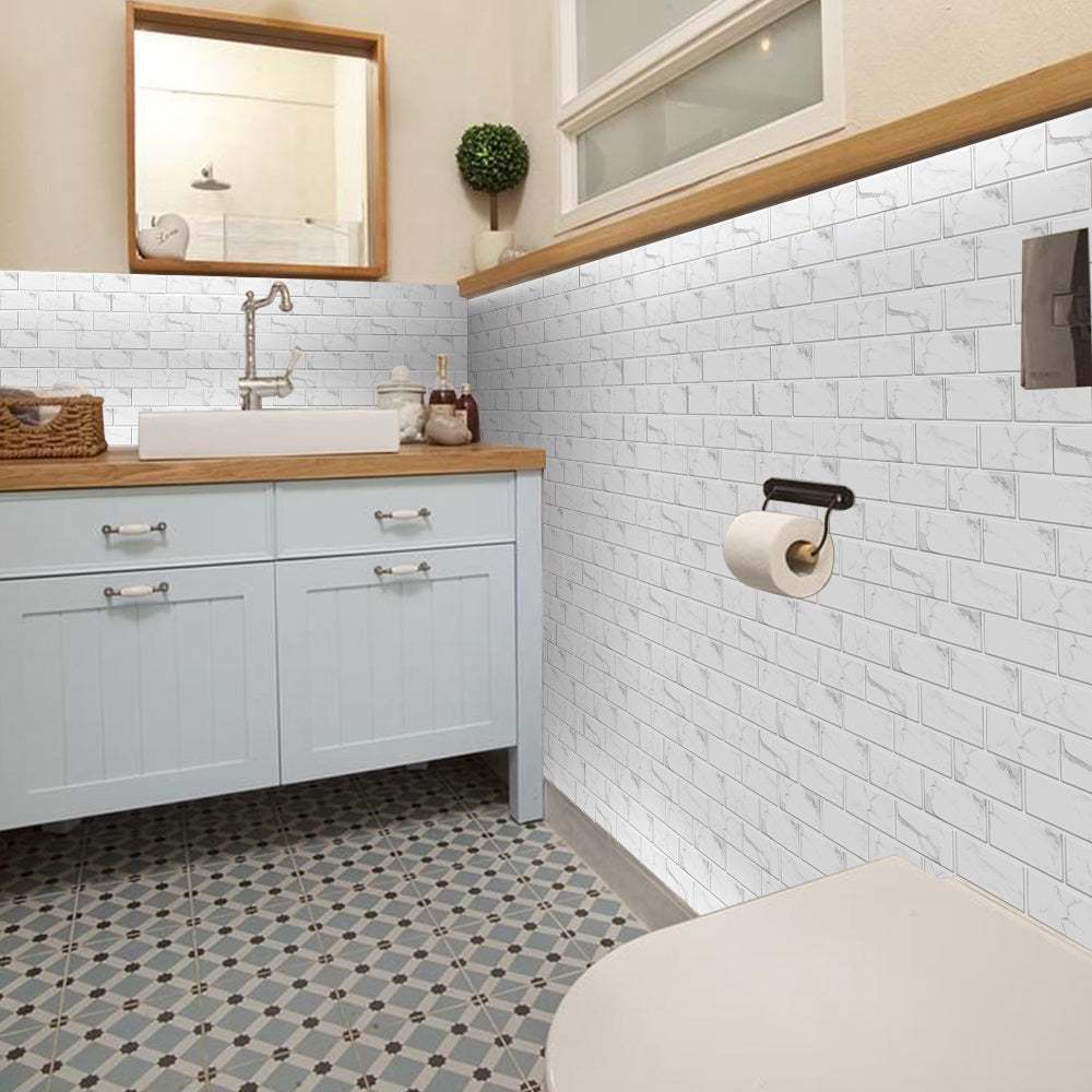 white marble look peel and stick wall tiles in bathroom with wooden countertop and patterned floor