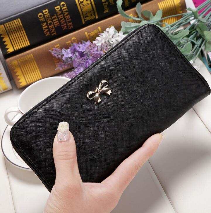 Black PU ladies wallet handbag with zipper and bow detail, 19x9.5x3cm size