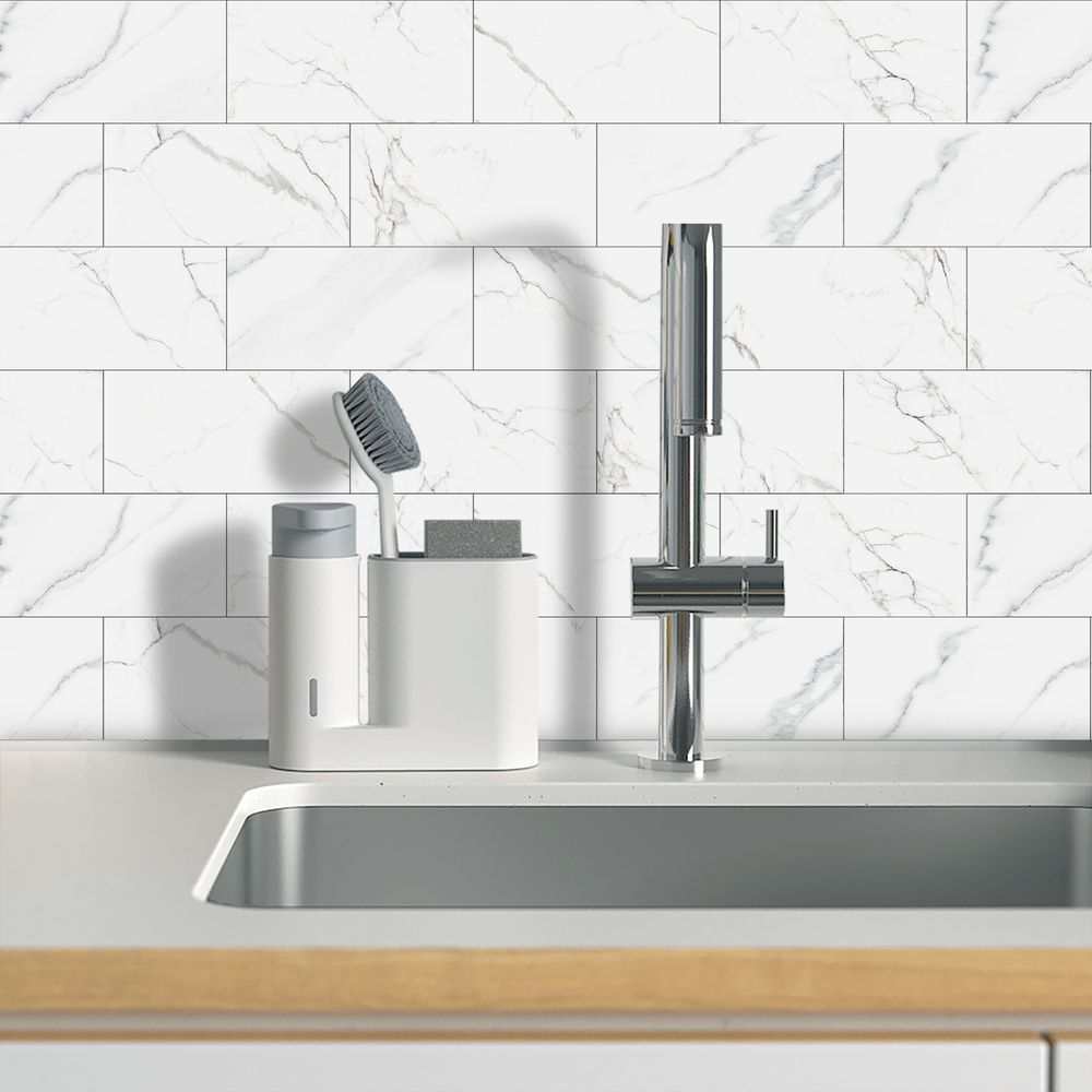 White marble look peel and paste splash-proof PVC wall tiles behind kitchen sink faucet