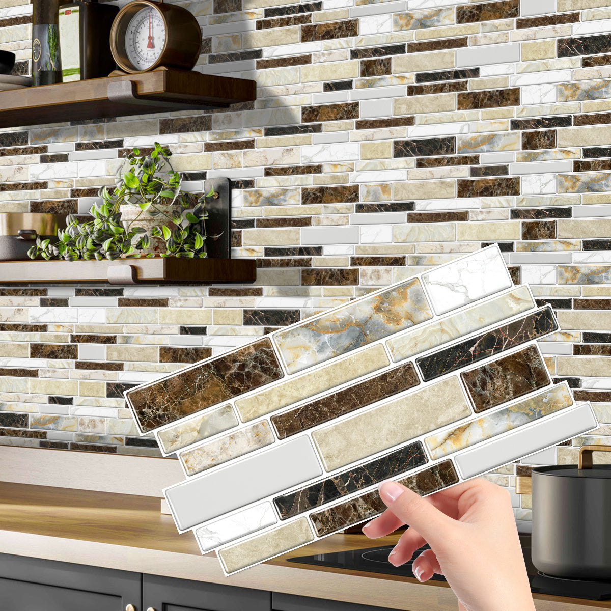 Hand holding classic imitation porcelain tile peel and stick backsplash with marble design in kitchen setting