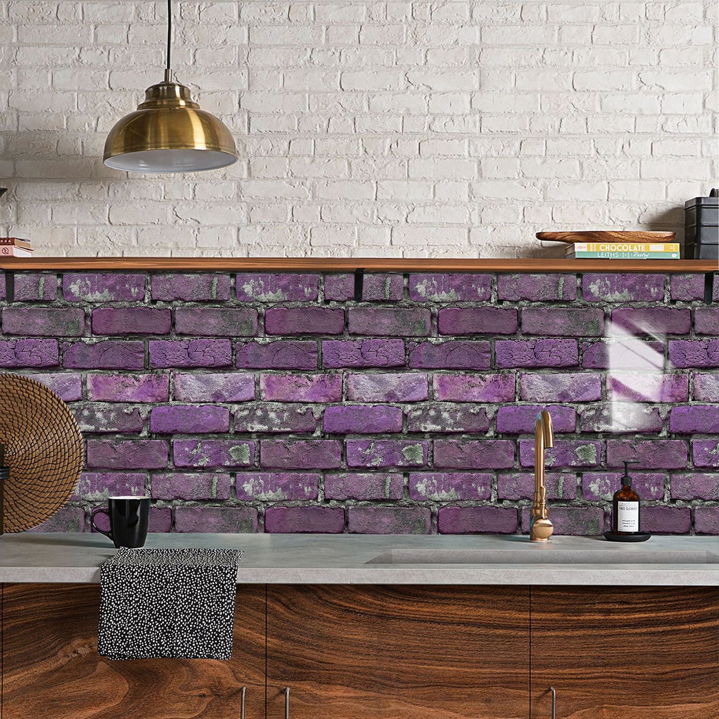 Purple peel and stick brick wall tile backsplash in modern kitchen with wooden cabinets and brass pendant light