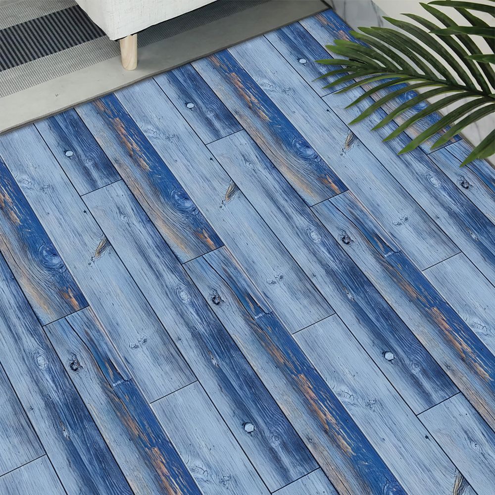 Blue wood grain peel and stick floor tiles with waterproof PVC self-adhesive surface in living room setting