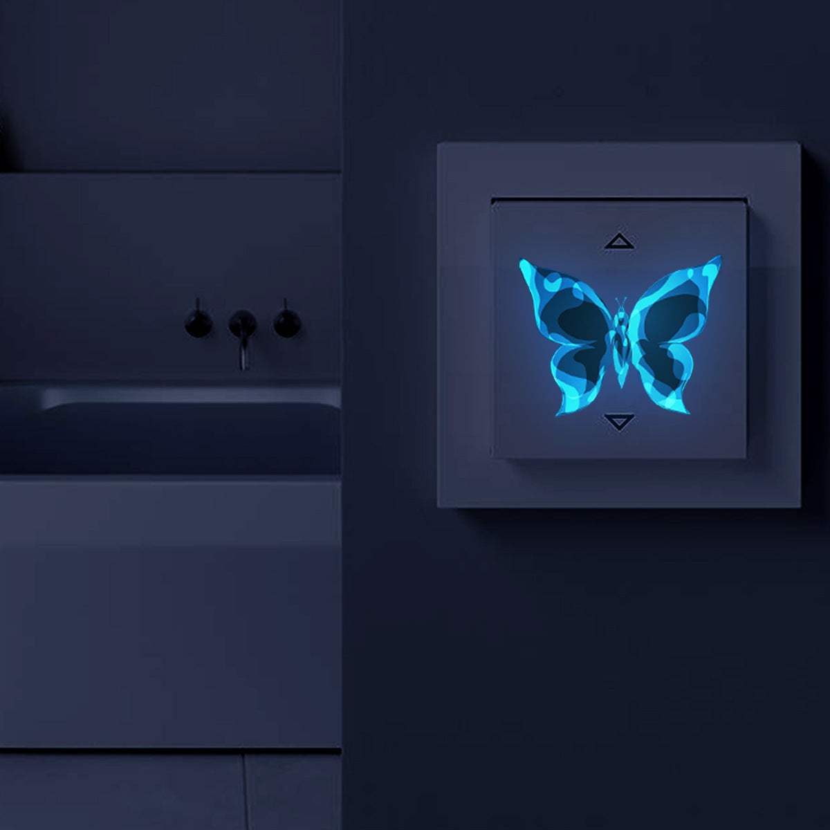 Blue luminous small butterfly glowing decorative wall sticker in dark room