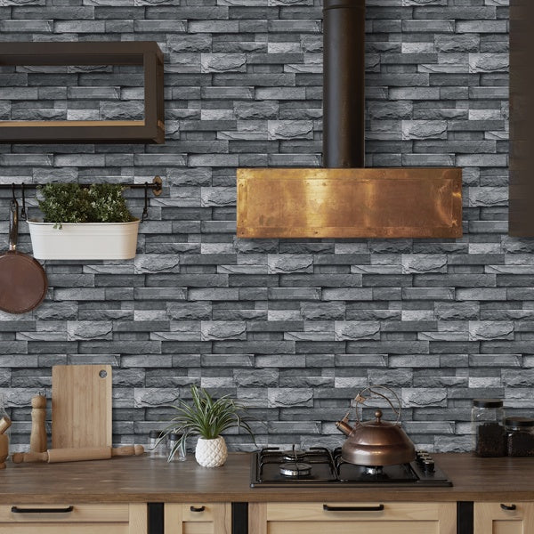 Light grey imitation stone tile peel and stick wallpaper in kitchen with wooden countertop and copper stove hood