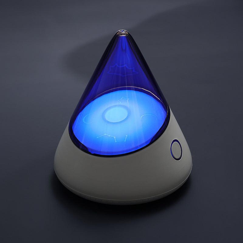 Colorful small night lamp with geometric design and blue light glow