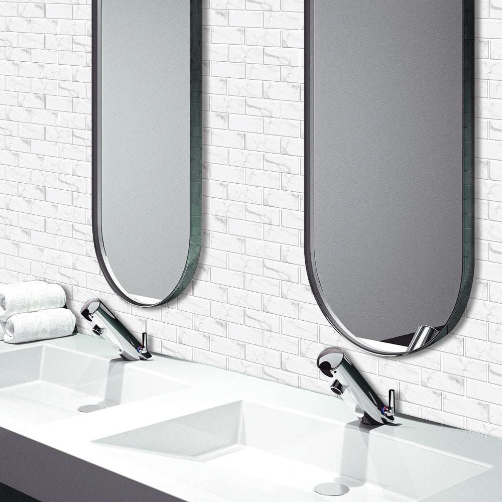 White marble look peel and stick PVC tile stickers on bathroom wall behind sinks and mirrors