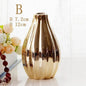 Nordic ceramic small flower vase in reflective gold with a minimalist design, 12cm height and 7.2cm diameter, ideal for home decor.