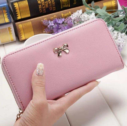 Pink PU ladies wallet handbag with zipper and bow detail, 19x9.5x3cm compact size