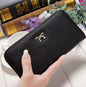 Black PU ladies wallet handbag with zipper and bow detail, 19x9.5x3cm size