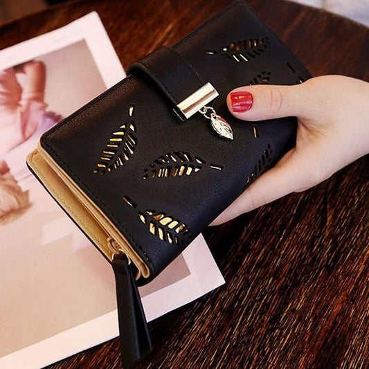black women's wallet purse with leaf cutout design and zipper pocket