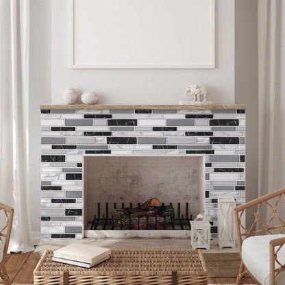 modern fireplace with black and white peel and stick backsplash tiles in living room