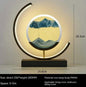 Chinese style hourglass table lamp with decorative glass and warm ambient lighting on a black base