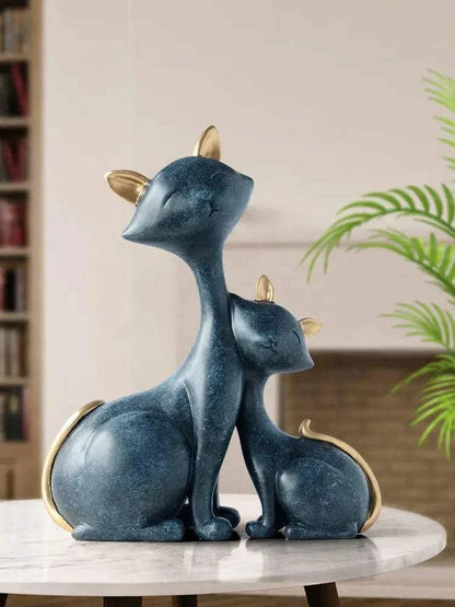 modern minimalist lucky cat figurine in blue with gold accents displayed on a marble table for home decor