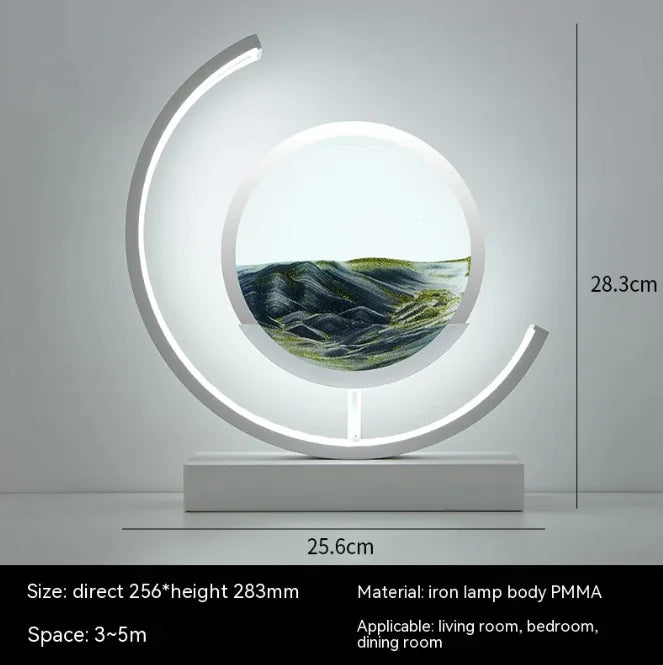 Modern Chinese style hourglass table lamp with illuminated circular iron frame and sand art centerpiece on white base
