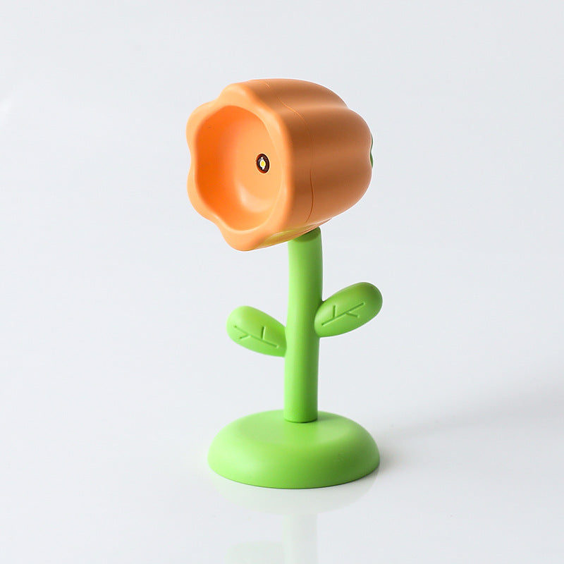 Mini magnetic small night lamp shaped like an orange flower with green stem and base for home decor