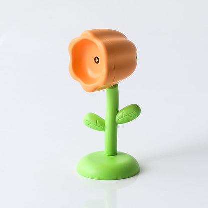 Mini magnetic small night lamp shaped like an orange flower with green stem and base for home decor