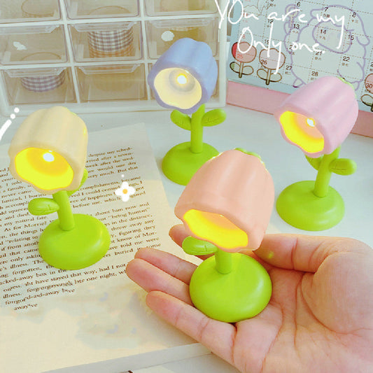 Mini magnetic small night lamp shaped like colorful flower pots with warm light and green bases.