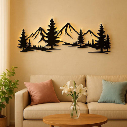 Rustic metallic wall art of evergreen forest and mountain silhouette above beige sofa in living room