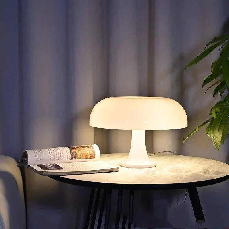 Mushroom table lamp with soft warm LED glow on a round table creating cozy ambiance