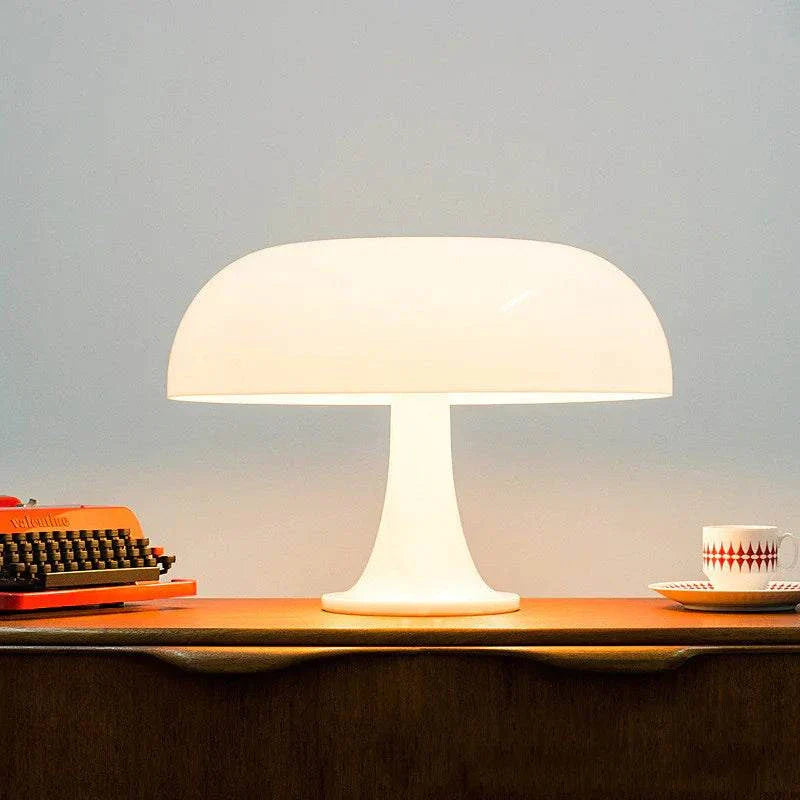 Modern white mushroom table lamp with soft LED glow on wooden desk