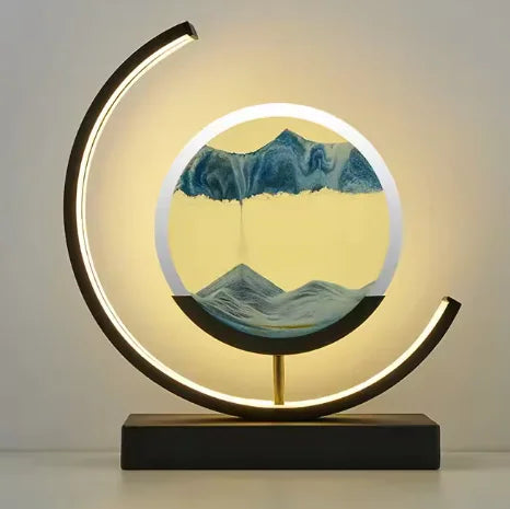 Chinese style hourglass table lamp with modern circular LED frame and flowing blue sand centerpiece on black base